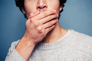 Man covering his mouth