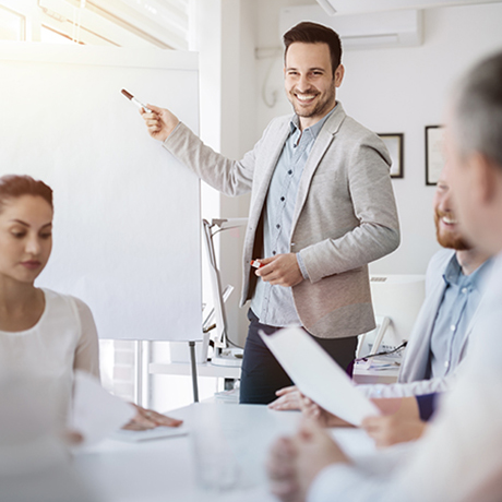 Smiling man giving a presentation